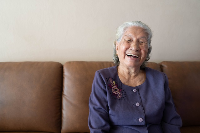 Older woman smiling big