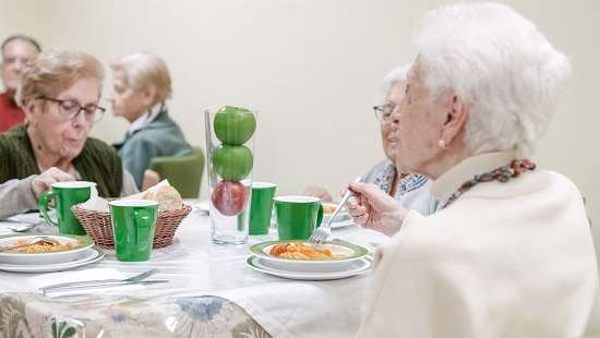 Group of seiors enjoying a communal dinner