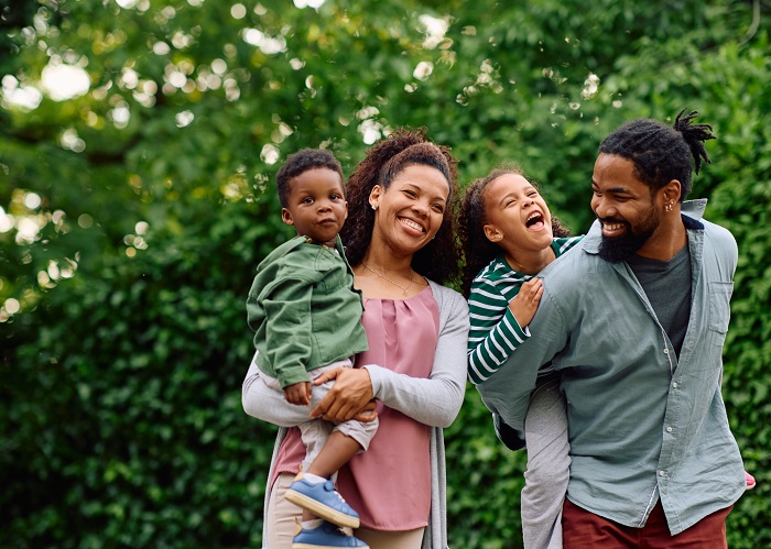 Family playing outside laughing